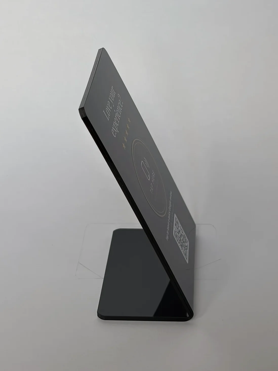 The tap stand in Noir from the side, showing its thickness and the folded foot.